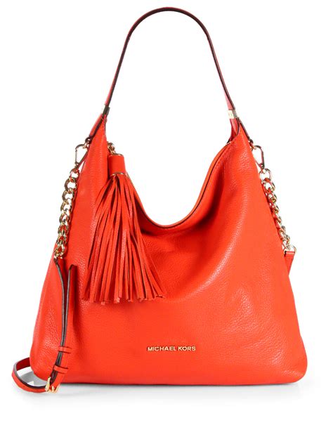 michael kors taschenanhänger tassel|Michael Kors opened satchel purse.